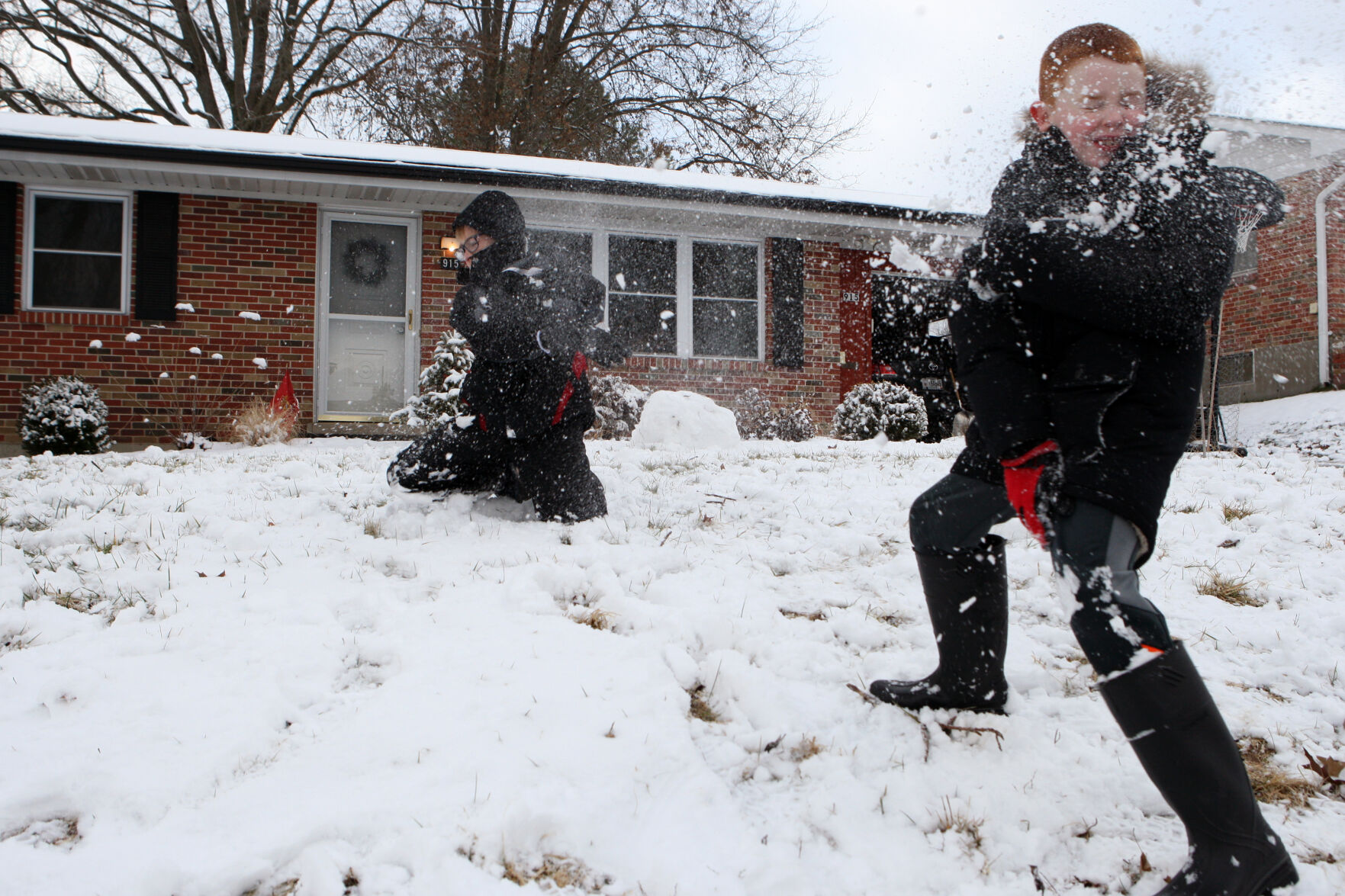 Nolan Seitz and Niko Josipovic throw snow